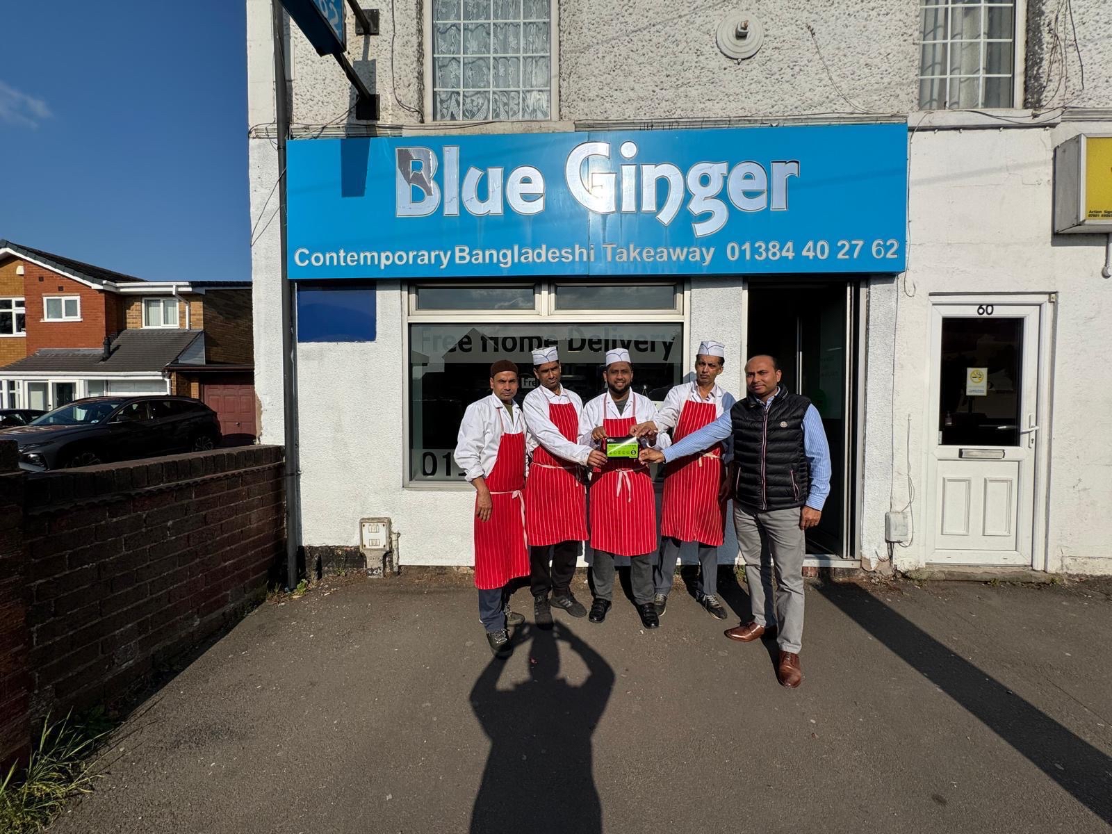 Person holding hygiene rating card